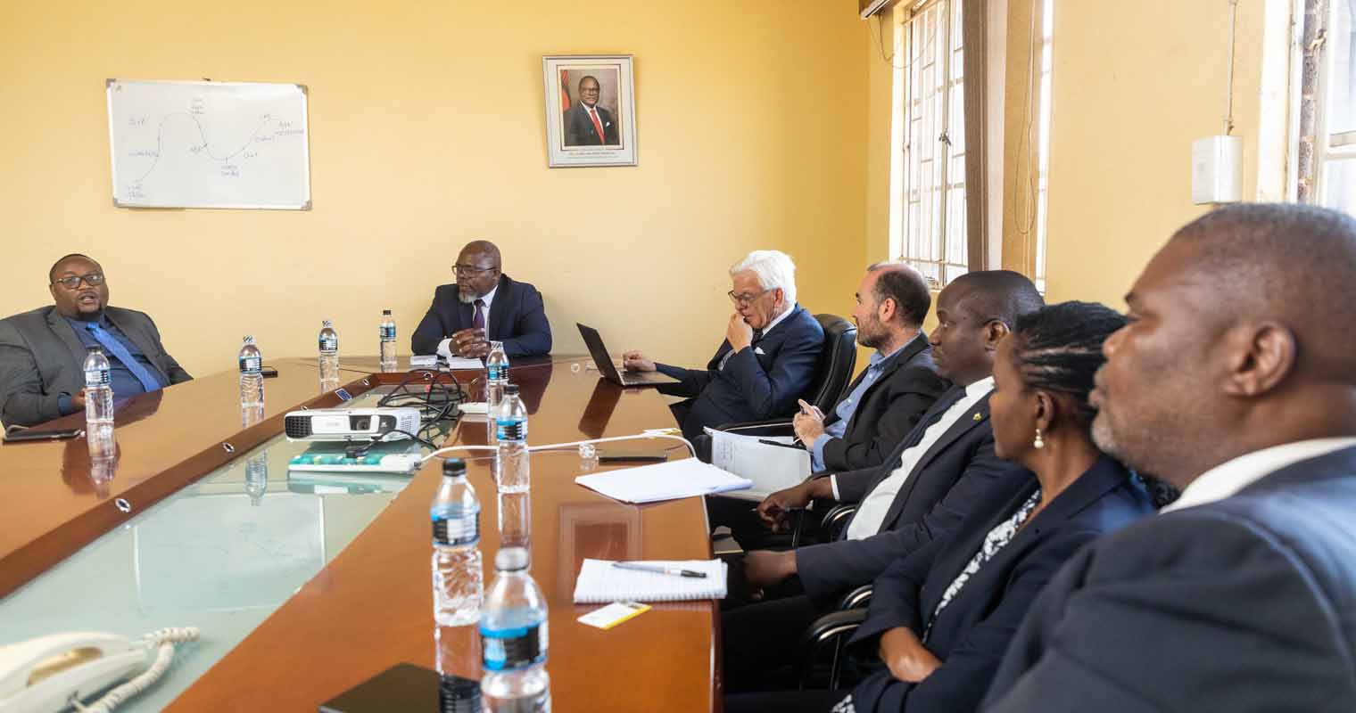 Mweeba stresses a point while the rest of the delegates look on