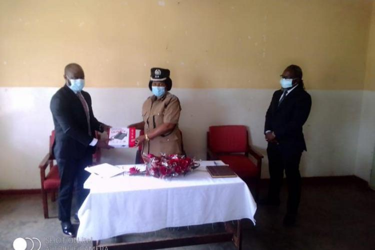 Handing over toll-free line phone at Kanengo Police Station