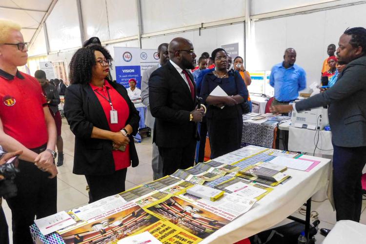Legal Aid Officer Jones Mpina giving a demonstration to the minister and MHRC officials