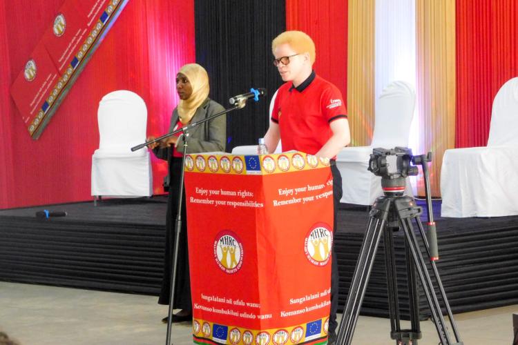 Commissioner Boniface Massah takes the stage