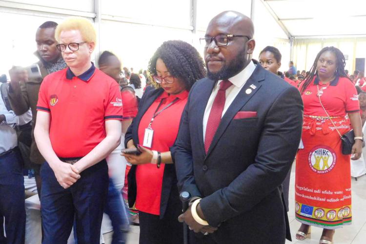 Minister Timothy Matambo and MHRC officials listening attentively