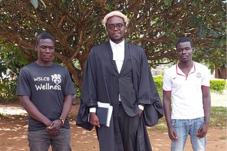 Counsel Clive Chiudzu with the Masulas at High Court