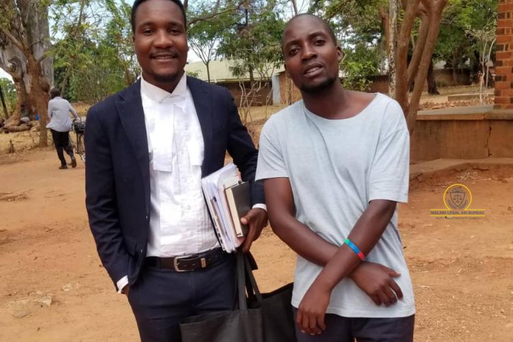 Senior Legal Aid Advocate Blessings Mkopoliwa with Banda after Court