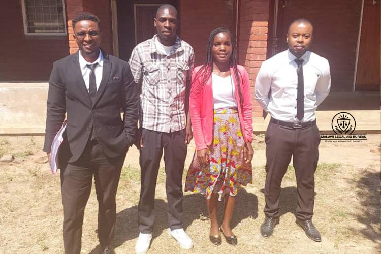 Counsel (in suit) with the two clients and ALAO (far right)